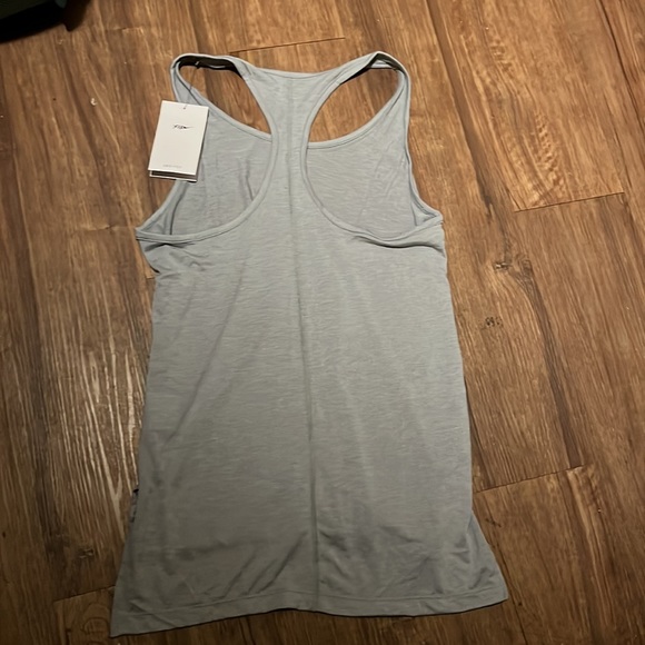 NWT Women’s is a beautiful “Nike Yoga Dri-Fit” top size small & in a nice grey - Picture 3 of 4